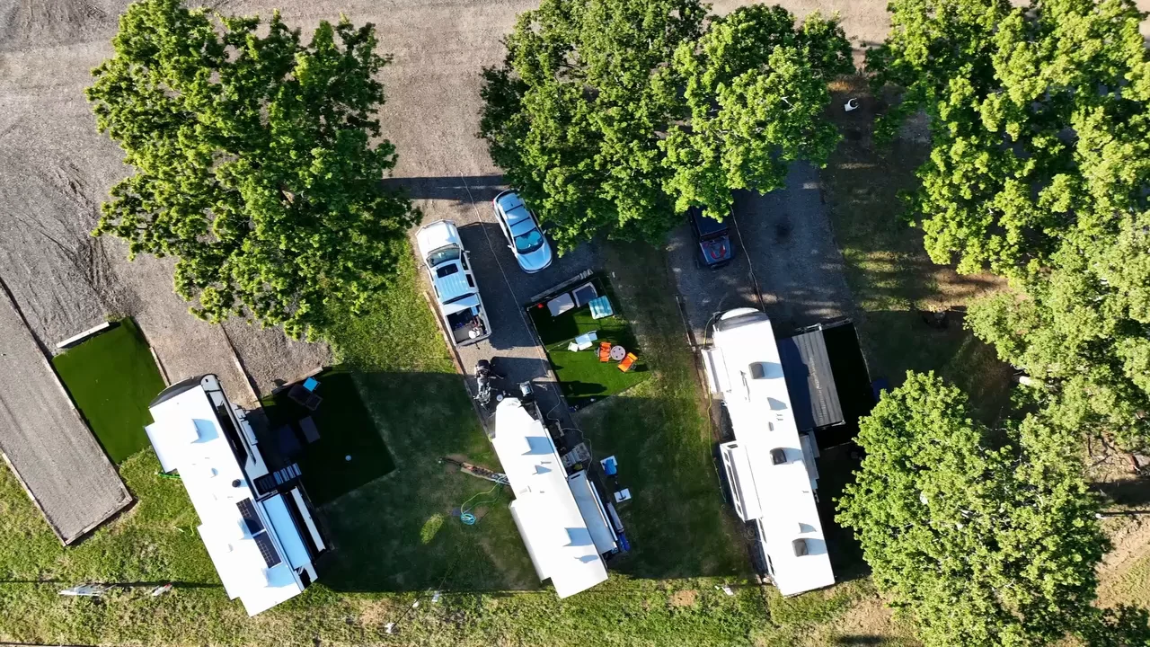 Aerial view over the oaks and the Lake Lewisville shoreline at Waterfront Hideaway Ranch
