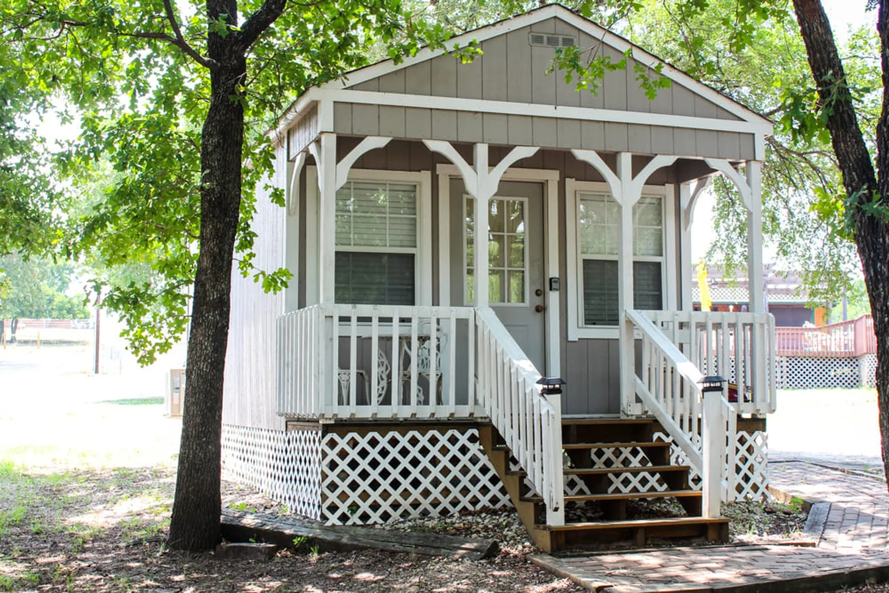 The white cottage at Waterfront Hideaway Ranch, one of three lake cabins near Dallas on the Lake Lewisville shoreline