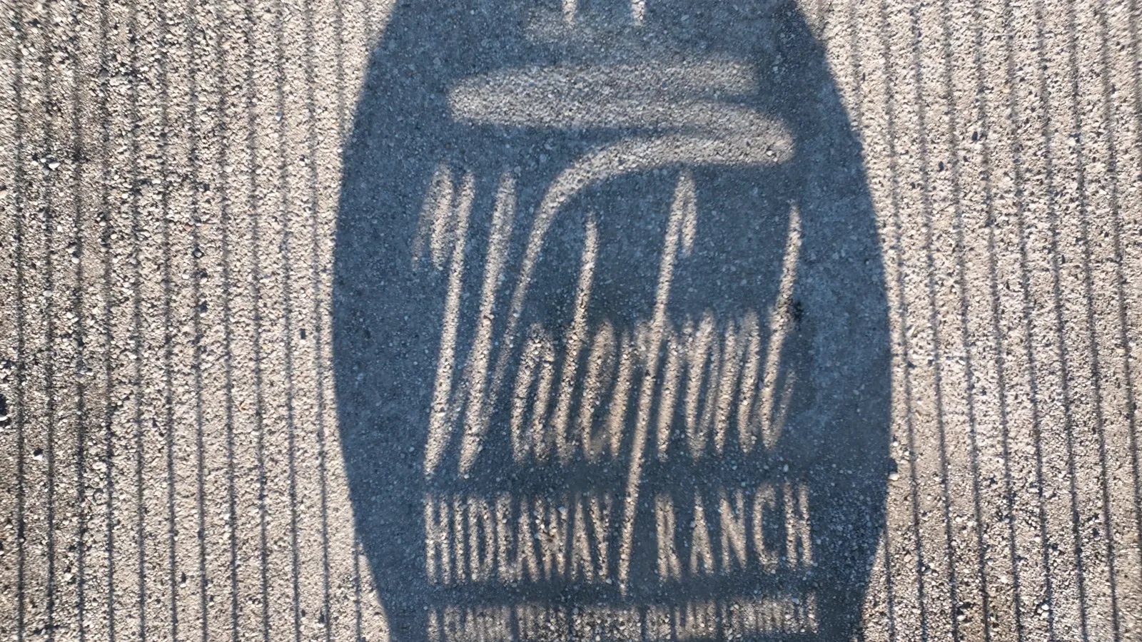 The Waterfront Hideaway Ranch sign on the entrance gate