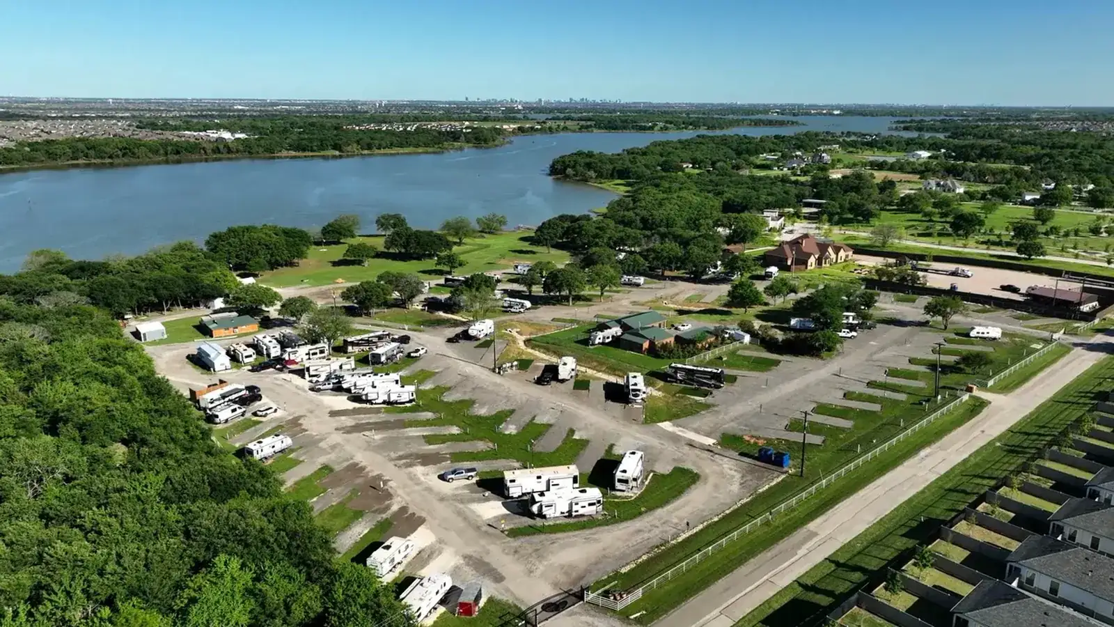 Aerial view over Waterfront Hideaway Ranch, a gated Lake Lewisville RV park, and its private shoreline