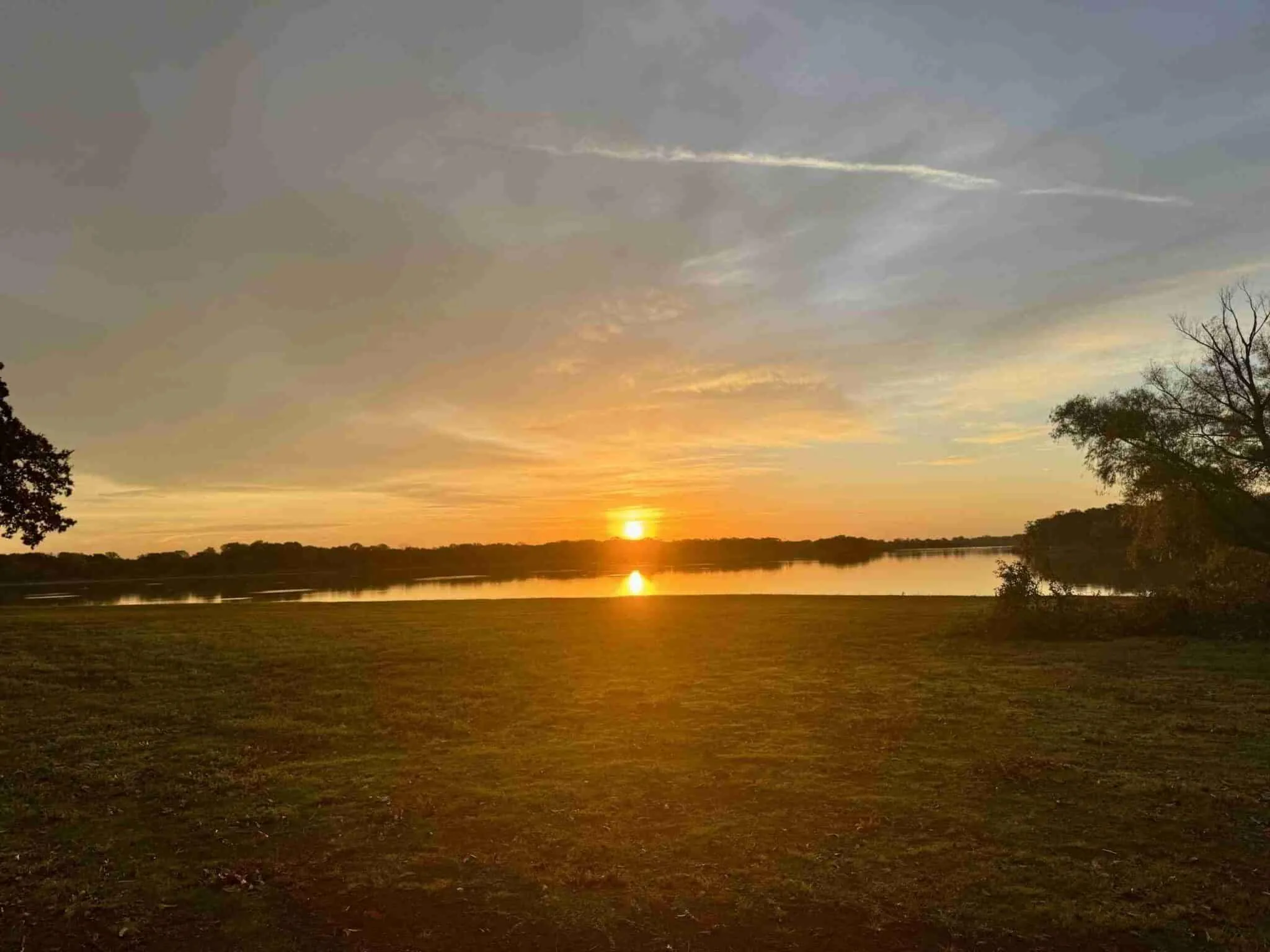 Sunset over Lake Lewisville from the private shoreline at Waterfront Hideaway Ranch, the subject of this Lake Lewisville guide