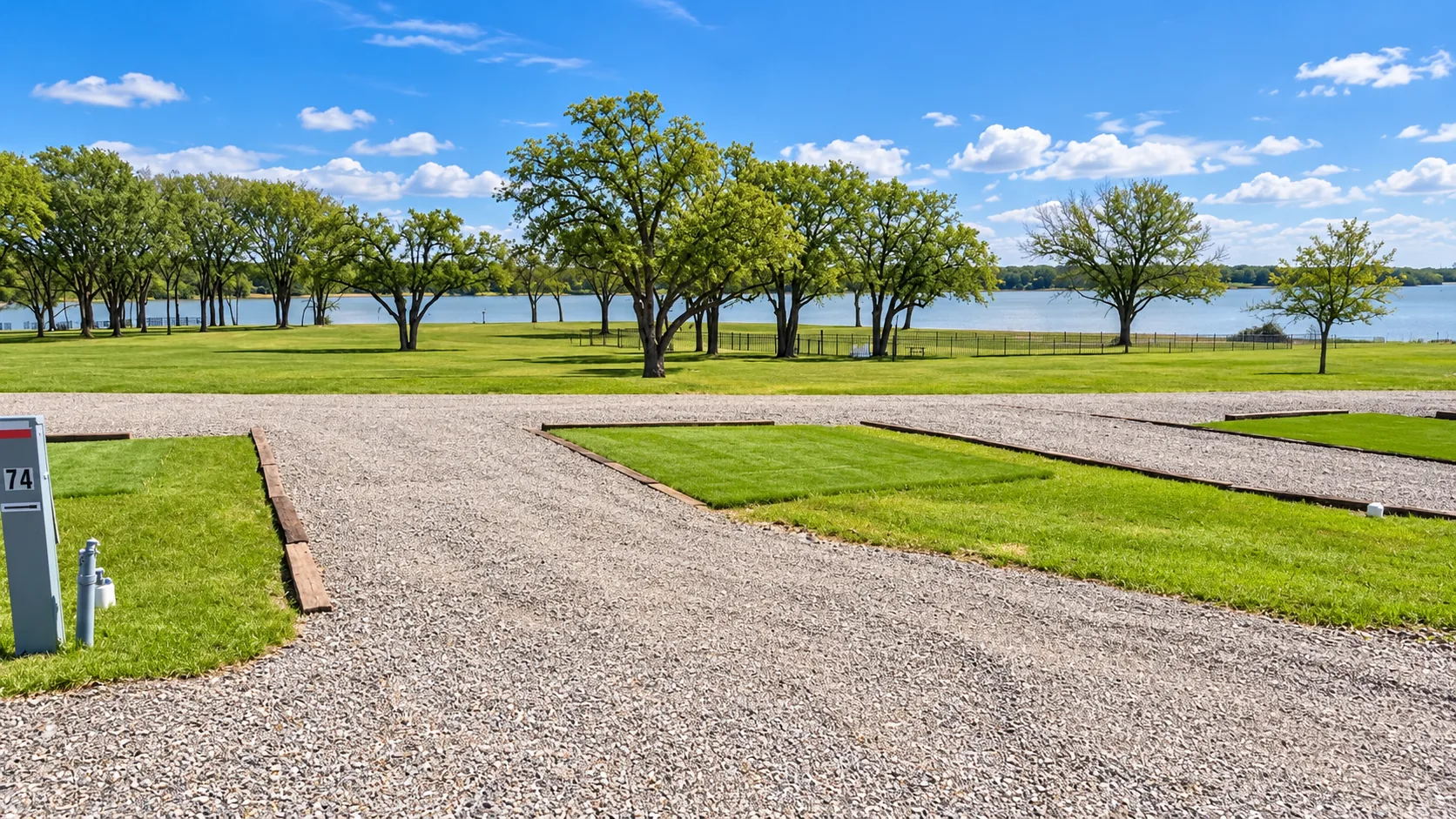 A waterfront full hookup RV site at Waterfront Hideaway Ranch, set up for a longer stay